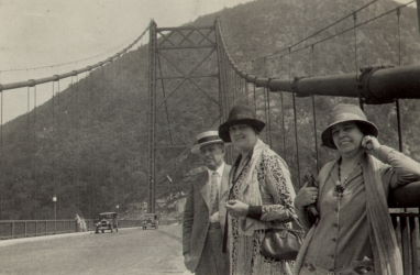 People posing with bridges