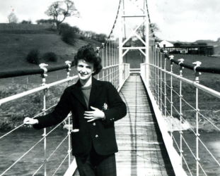 People posing with bridges